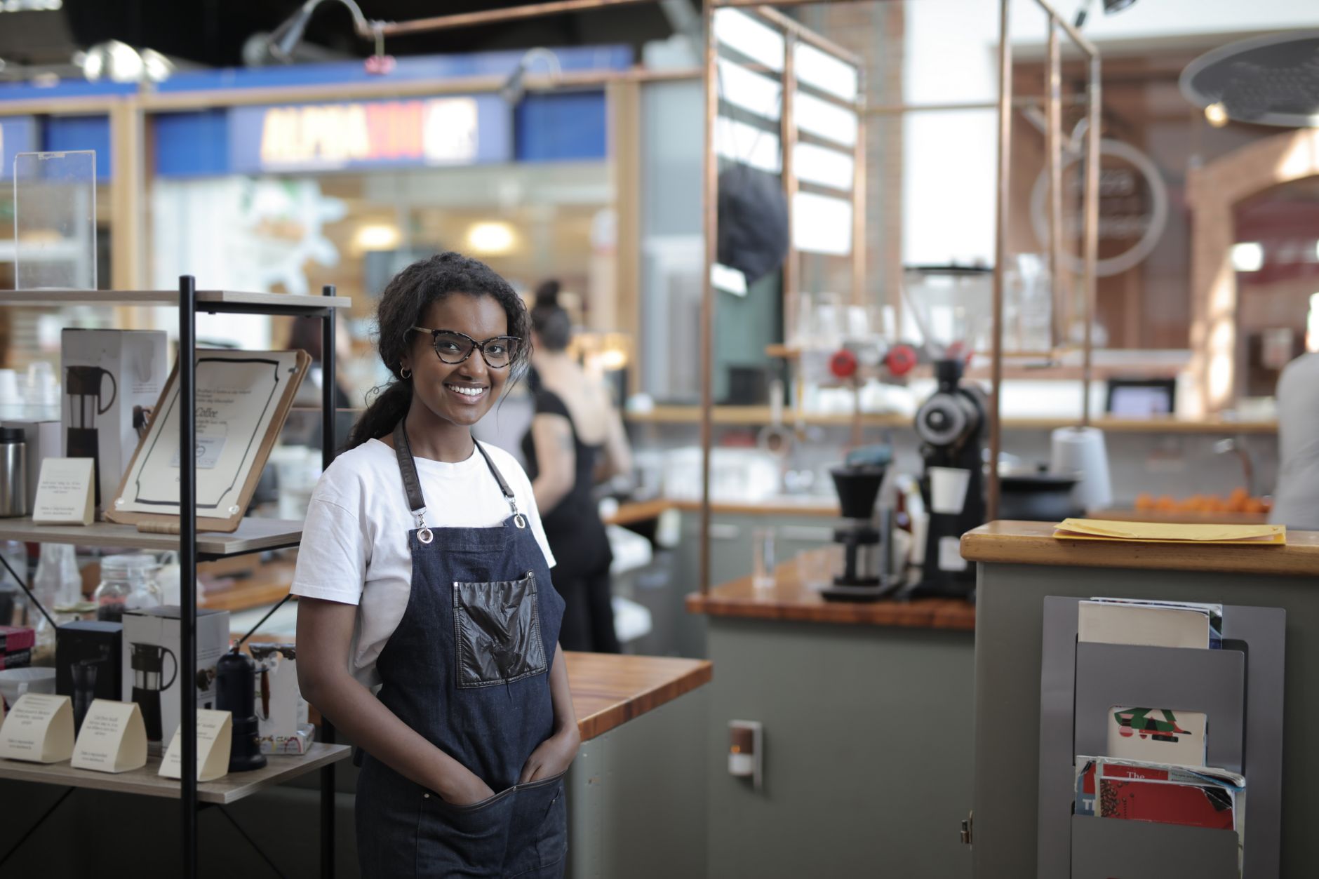 A small business owner in their cafe, the self-employed borrower lenders assess differently