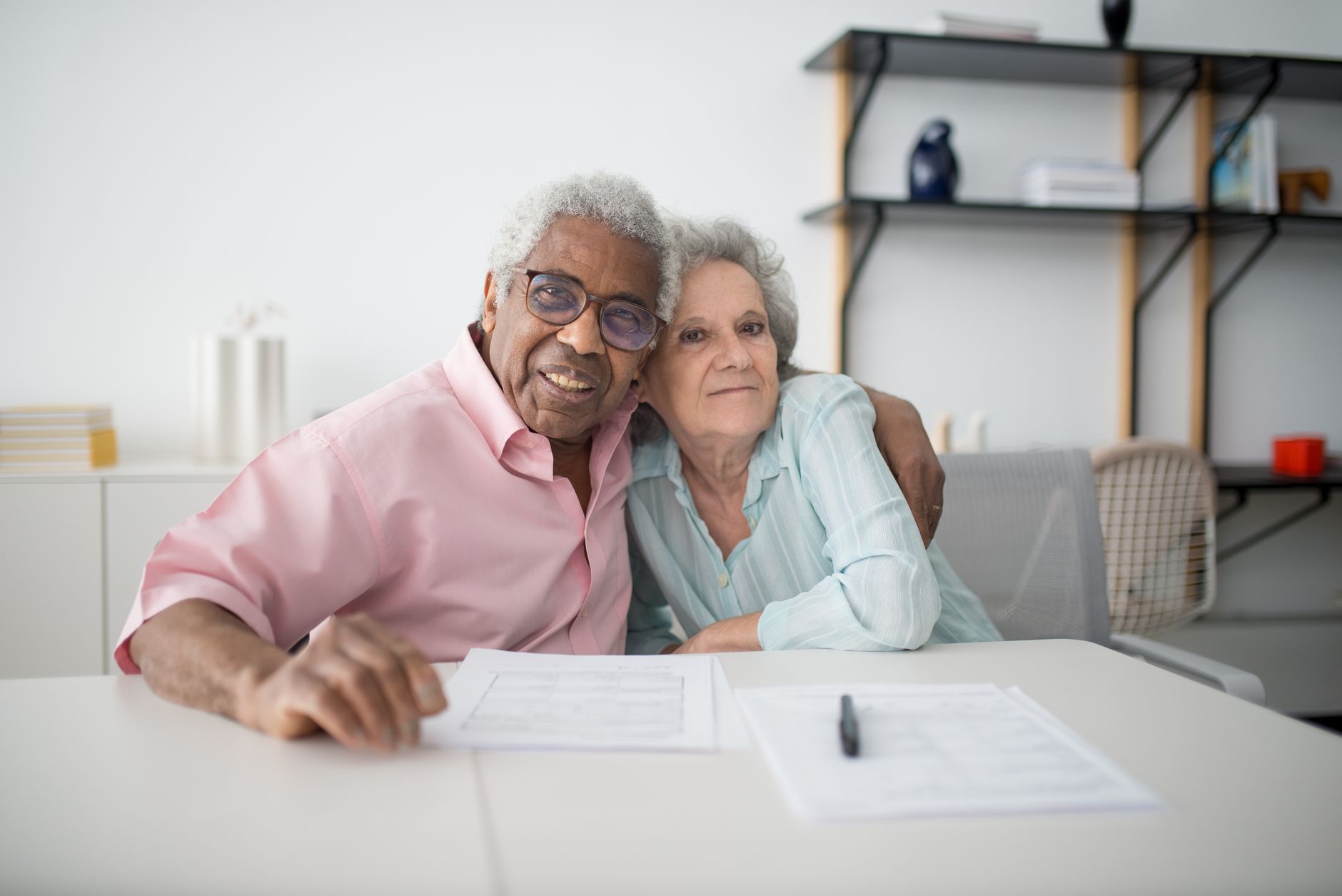 An older couple reviewing paperwork at home, the SMSF lending conversation after 10 August 2026